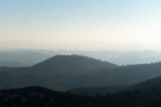 Landscape of mountain layers in haze fading in distance, view from mountain Ljubic near Prnjavor