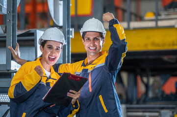Man mentor and young employee trainee stand for operating machine looking see through camera...