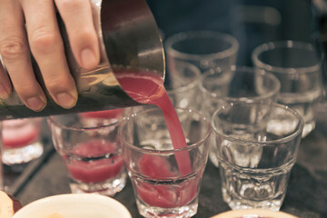 Detail of a cocktail mixology tasting event, no people are recognizable.