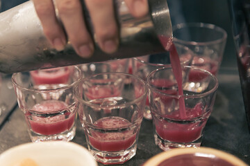 Detail of a cocktail mixology tasting event, no people are recognizable.