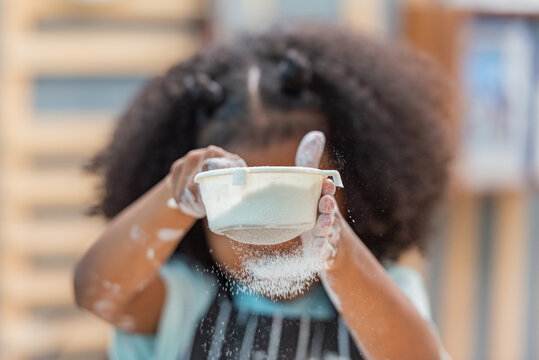 african afro black daughter kids sifting flour powder and sprinkling ingredients on massaging dough for bakery cooking. Black african daughter afro hair enjoy sifting flour wheat by sieve in kitchen