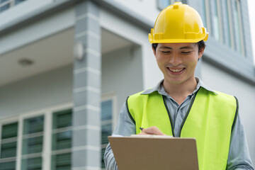 inspector or engineer is inspecting construction and quality assurance new house using a checklist. Engineers or architects or contactor work to build the house before handing it over to the homeowner