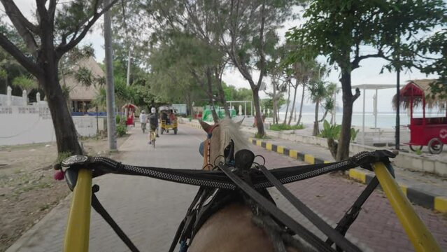 POV Riding a Carriage Horse as a Transportation in Gili Trawangan Island Indonesia