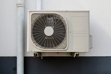 air conditioner condenser unit at exterior wall