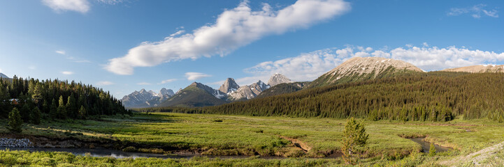 Stunning nature views in Kananaskis during summer time with early morning, sunrise glow on scenic mountain scenery.
