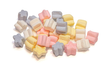 heap of multicolored fluffy star-shaped sweet marshmallows icolated on white