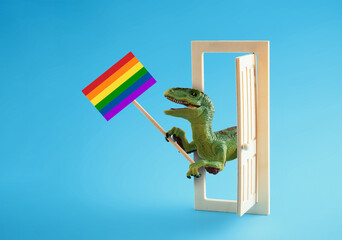 Cute dinosaur holding sign with rainbow flag on blue background. Modern minimal art greeting card...