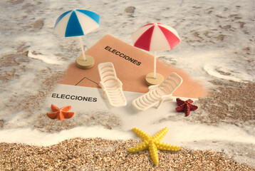 General elections in summer, some electoral envelopes in the sand on the beach