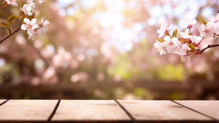 Wooden board empty table top on of blurred background. Perspective brown wood table over blur in sakura garden background