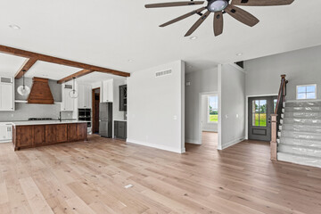 brand new white kitchen counter tops and raw stained wood cabinets and kitchen island. 