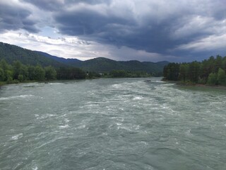Blue water of fast stormy river Katun
