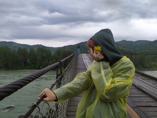 Woman on the bridge over a river