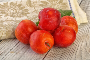 Red juicy raw plum heap