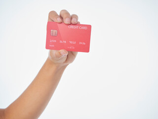 Woman holding credit card on white background