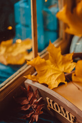 Yellow Autumn Leaves by the Window. Season Fall Concept. Vintage style.