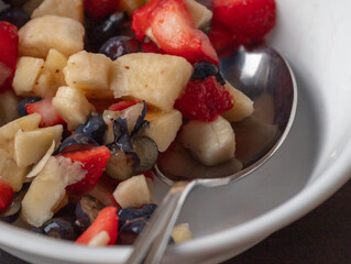 Fruit salad served with spoon