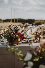 Fototapeta na wymiar outdoor wedding decoration. Table setting with flowers.