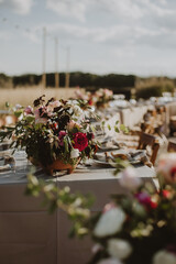 outdoor wedding decoration. Table setting with flowers.