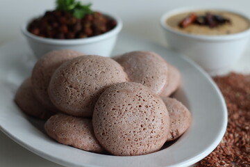 Navara rice idly served black chickpea curry. Steamed savoury rice cake made by a batter of fermented de husked black lentils and navara rice.