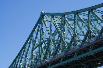 Beautiful Pont Jacques-Cartier bridge on the sunny side in the early morning. Made in steel in the 20's