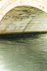 Detail of clear water and minimalist look of under the bridge 