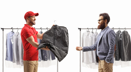 Man delivering dry cleaned clothes to a bearded man