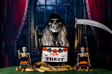 Halloween grim reaper ready for trick or treat