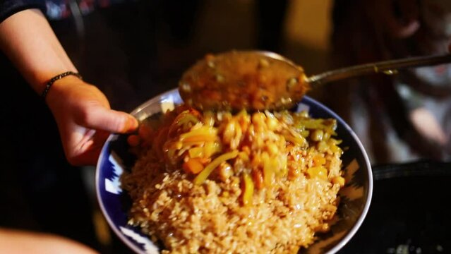 The plov is served in the plates