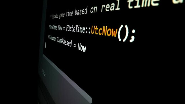 Closeup macro shot movement of coding script moving across LED screen with real-time AI-generated typing, showcasing advanced AI learning in optimization, debug and coding for software development.