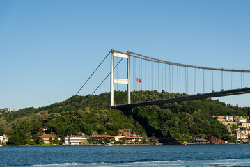 Fatih Sultan Mehmet Bridge and Turkish Flag on the Bosphorus. Istanbul, Turkey. (Fatih Korosu,...