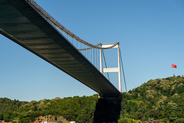Fatih Sultan Mehmet Bridge and Turkish Flag on the Bosphorus. Istanbul, Turkey. (Fatih Korosu, Fatih Sultan Mehmet Köprüsü)