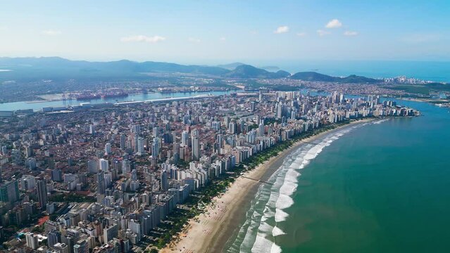 Drone view of the entire island of Santos bathed by the ocean. Port of Santos in the background. Santos, S&atilde;o Paulo, Brazil.