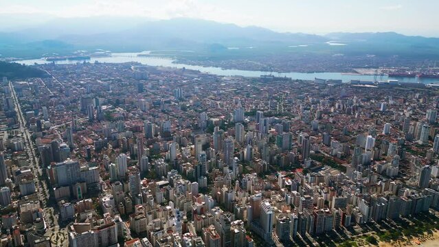 Aerial view of the coastal city. Center of a Brazilian city. Hills in the background. Santos, S&atilde;o Paulo, Brazil.