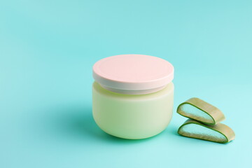 Aloe vera slices and cream cosmetic container mockup
