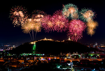 firework festival Pra Nakorn Kiri in Petchaburi Thailand. famous fireworks display over three pagodas on Khao Wang hill at night.