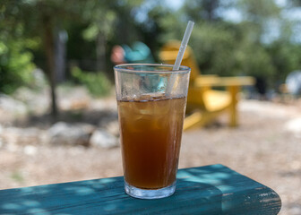 glass of ice tea outdoors