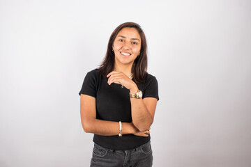 Portrait of smiling latina woman on light background. Concept of people and portraits.