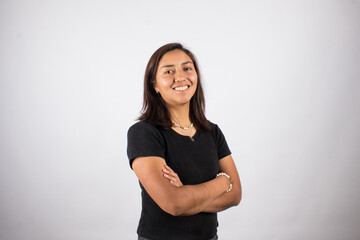 Portrait of smiling latina woman on light background. Concept of people and portraits.