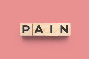 Pain wooden cubes on red background