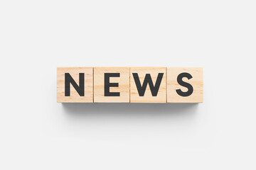 News wooden cubes on grey background