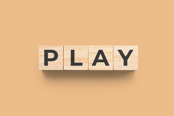 Play wooden cubes on orange background