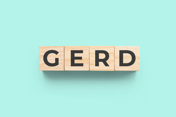 GERD (Gastroesophageal Reflux Disease) on blue green background - obrazy, fototapety, plakaty
