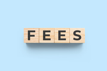Fees wooden cubes on blue background