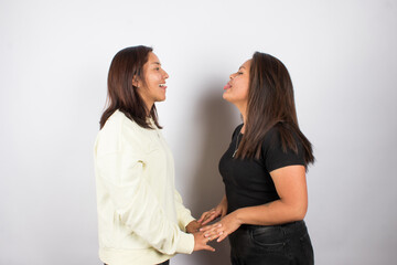 beautiful photograph of a lgbt couple on a light studio background.