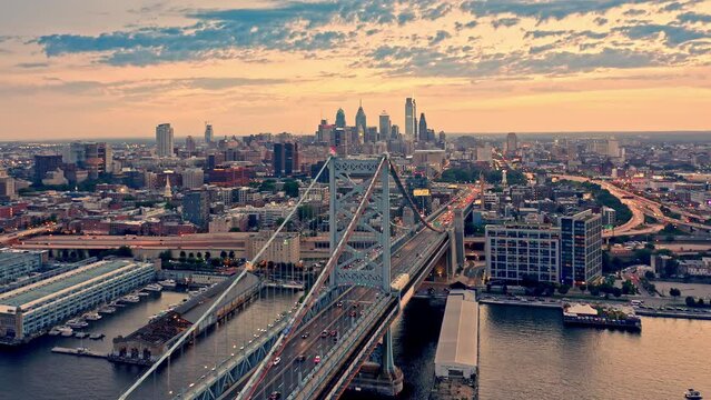 Aerial view of the Philadelphia skyline with a slow camera rotation around Ben Franklin Bridge.