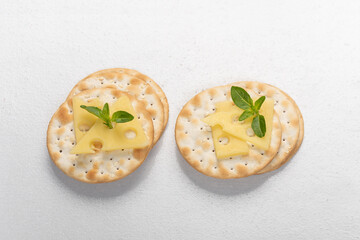 snack of blacha with cheese, decorated with basil leaf