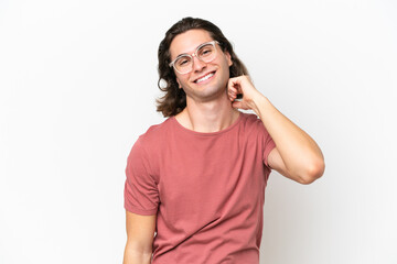 Fototapeta premium Young handsome man isolated on white background laughing