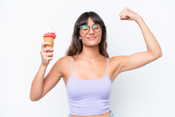 Young caucasian woman with a cornet ice cream over isolated white background doing strong gesture