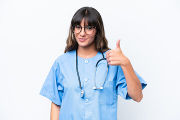 Young caucasian nurse woman isolated on white background with thumbs up because something good has happened