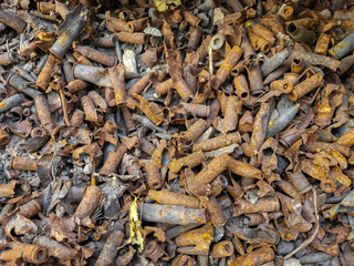 Burned cartridges and casings for firearms that exploded in an ammunition depot.